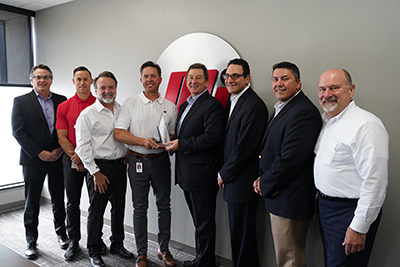 Motion and Gates officers at the award presentation, L-R: Scott Wright (Gates); Chris Brewer, Joe Limbaugh and Kevin Storer (Motion); Grant Gawronski, Lou Rosen and Mark Guner (Gates); and Robert Anaforian (Motion).