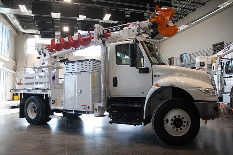 Versatile trucks that include multiple functions use all the available space in their flexible designs, meaning you may need only one truck at your job site. Image courtesy of Terex Utilities