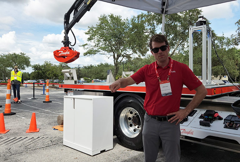 Chad Larish, Principal Engineer - Controls Division at Danfoss Power Solutions, demonstrates the company's autonomous solutions after discussing the phases of electric machines.