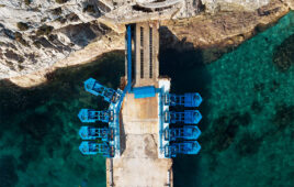 Buoyant floaters convert incoming wave action into hydraulic cylinder motion, which produces high-pressure fluid that powers a hydraulic motor and generator. Courtesy of Eco Wave Power