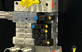 The Festo CIP safety module, lower right with red stripe, connects directly to this Allen-Bradley safety controller, top center, simplifying wiring and reducing cost.