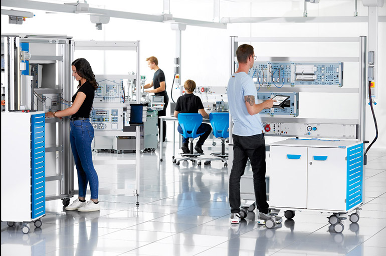 Students in a modular training lab at Festo