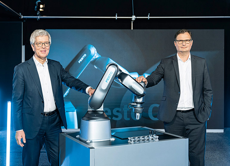 Dr. Frank Melzer, Member of the Management Board for Product and Technology Management, left, and Christian Tarragona, Head of Robotics at Festo, right.