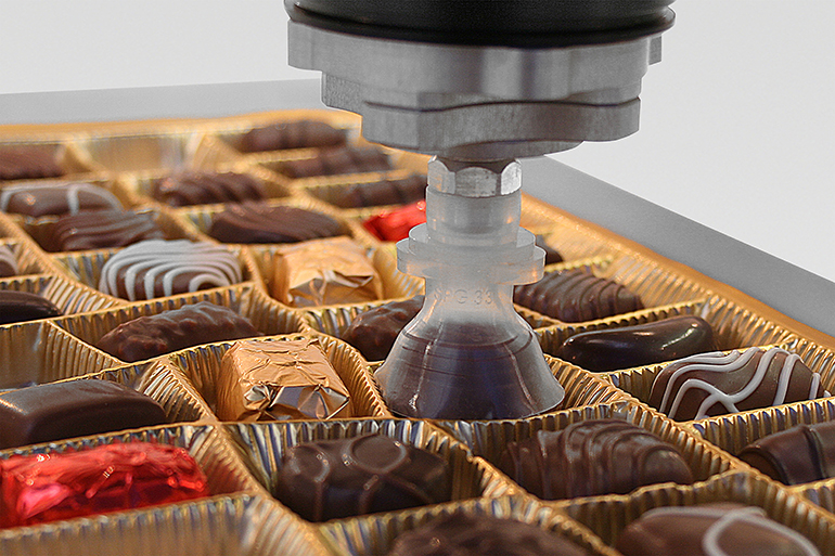 The bell-shaped SPG praline gripper, designed for use with picker robots, is designed for highly dynamic handling and packing of chocolates regardless of shape. | courtesy of J. Schmalz GmbH