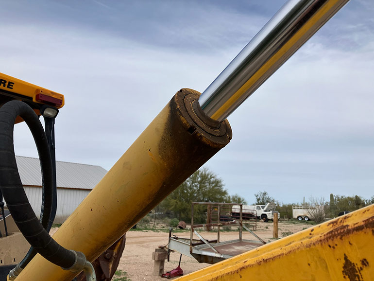 External hydraulic cylinder leakage is usually very obvious to spot, as you can see from the darkened oil sludge on this machinery. | Courtesy of Ken Korane