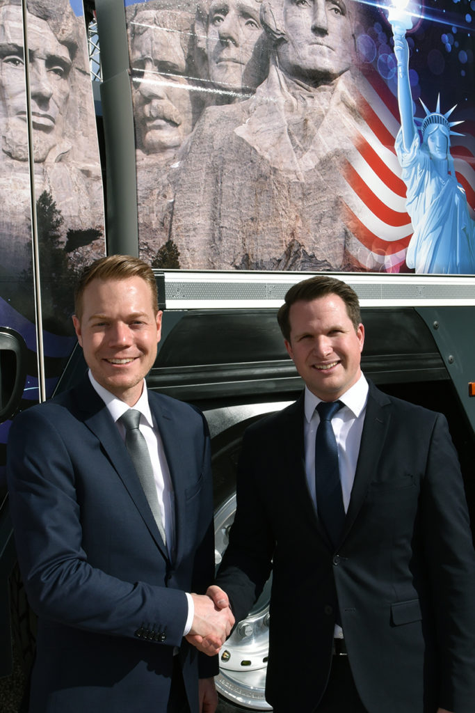 Daniel Pitzer (left) handing over the US market responsibility for Lieberr mobile cranes to Pierre Bilgeri (right).