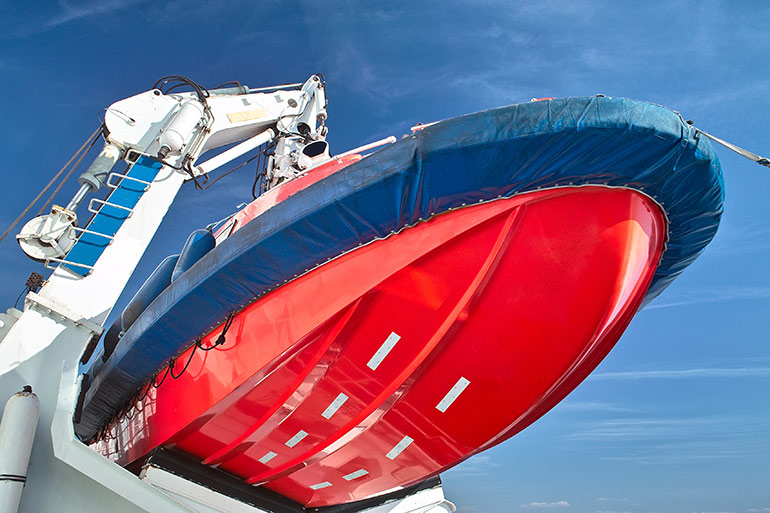 Figure 4. The davit lifts and lowers the lifeboat safely to the ocean surface. The system uses hydraulic cylinders for safe extension and accumulators for power redundancy. Image courtesy Adobe Stock