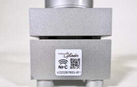 A Milwaukee Cylinder electronic service tag QR code on the surface of a hydraulic cylinder.